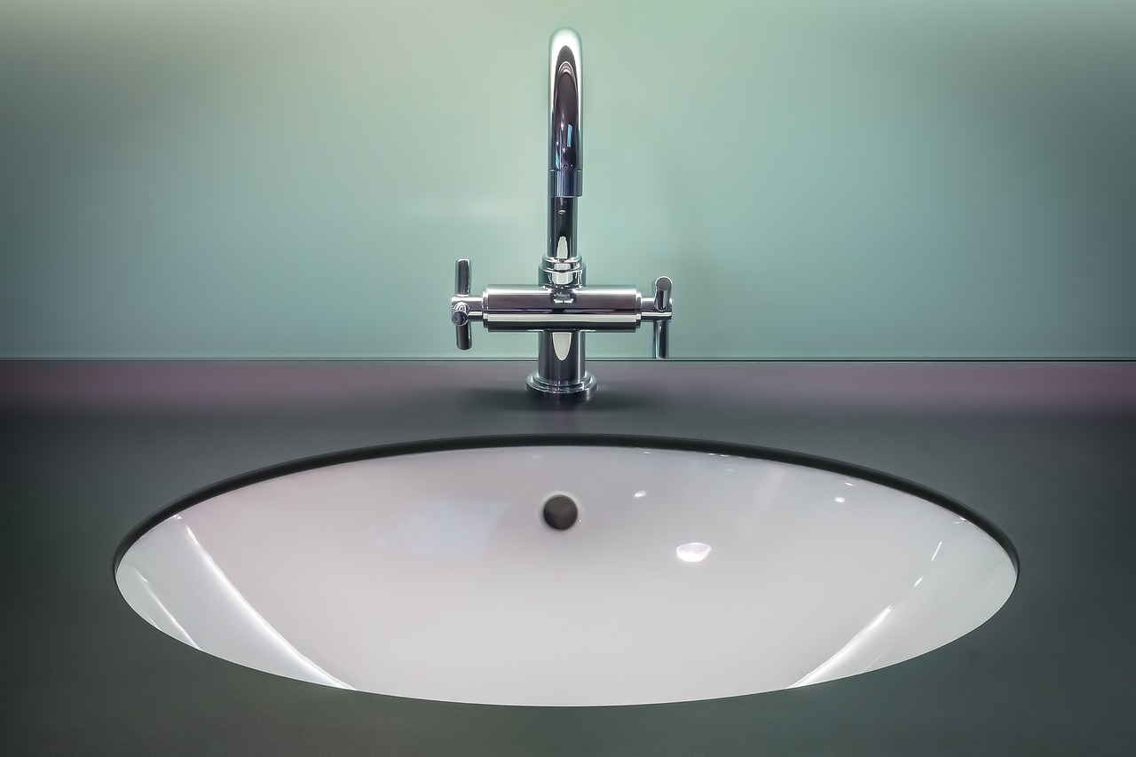 Accessible bathroom layout with floating vanity, comfort-height toilet, and grab bars in Fort Myers home