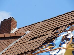 Homeowner documenting hurricane roof damage in Fort Myers Florida