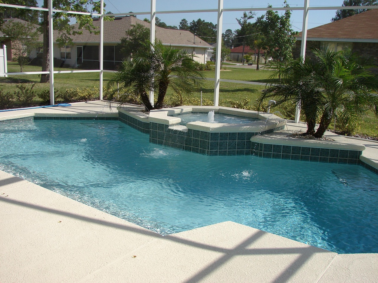 Interlocking concrete pavers installed around a Cape Coral pool deck with edge banding