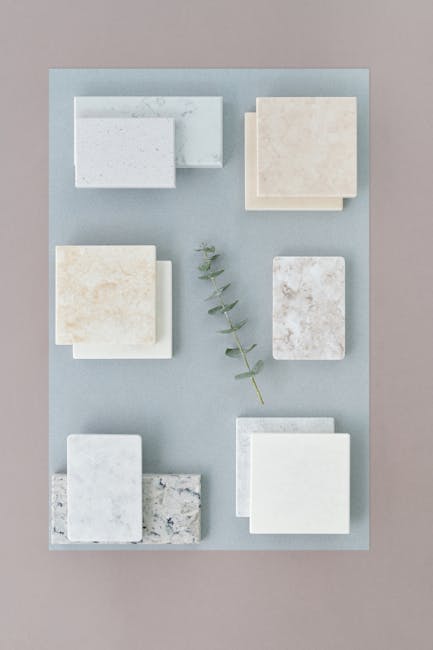 Quartz and granite countertop samples displayed in a Fort Myers kitchen showroom