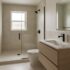 Small remodeled modern bathroom with a frameless glass walk-in shower and floating vanity