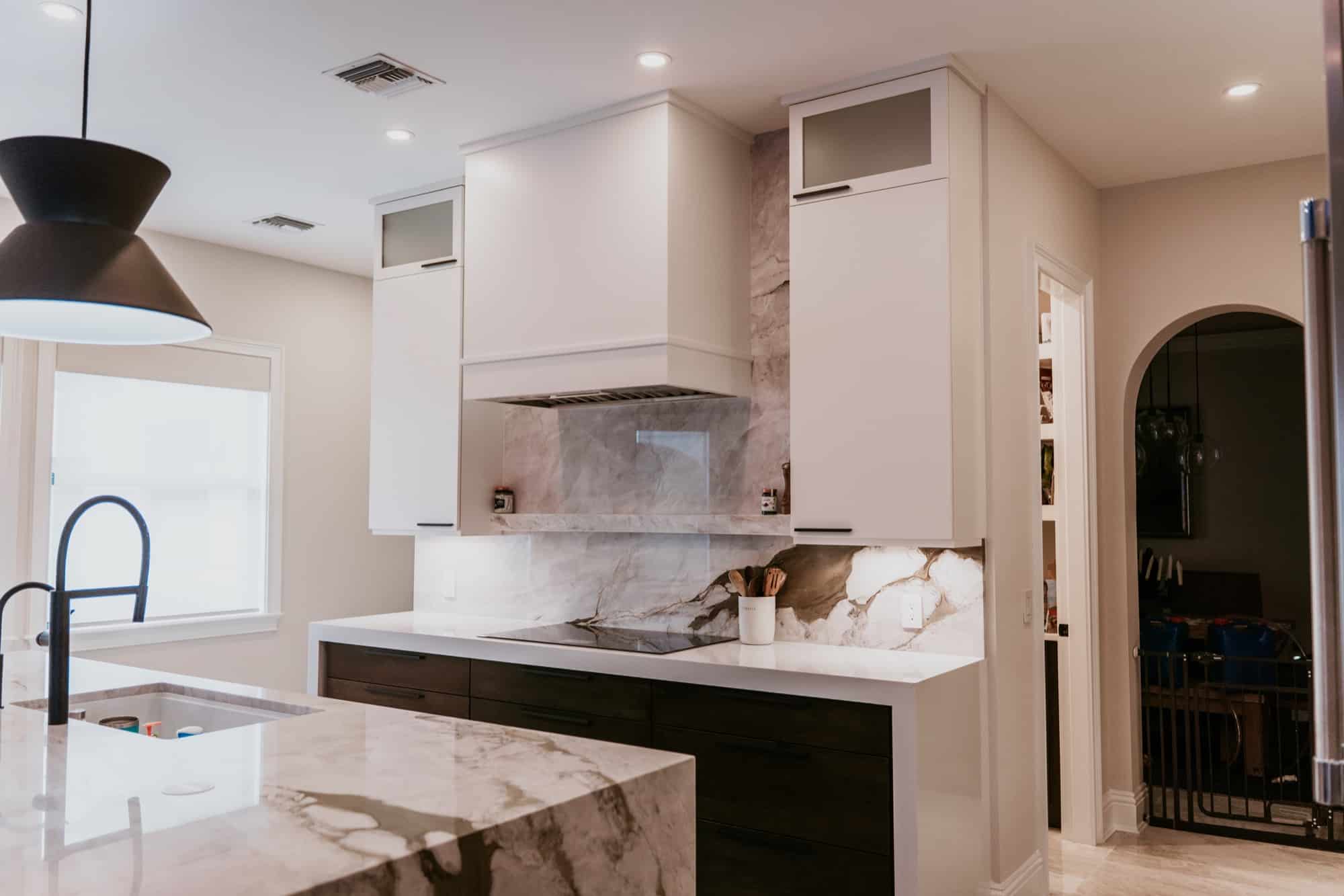 Kitchen remodel with continuous polished stone-look flooring, Alliance Construction project