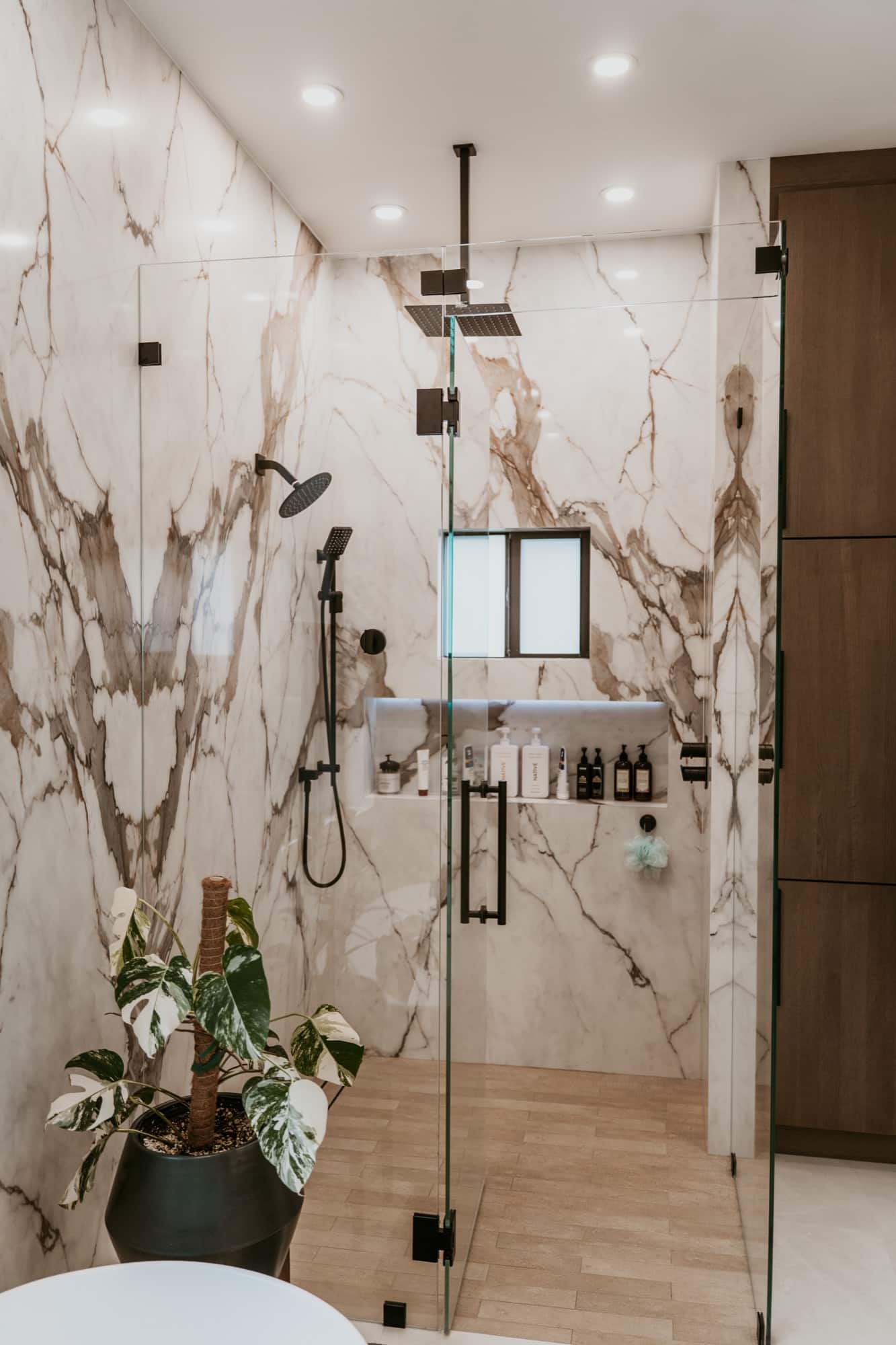 Bath: marble walk-in shower. Alliance Construction remodel, Southwest Florida