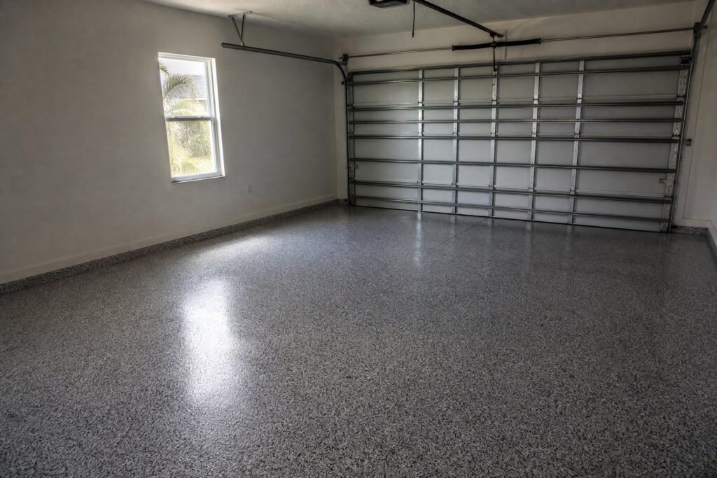Garage with a finished epoxy flake floor coating in a Cape Coral home
