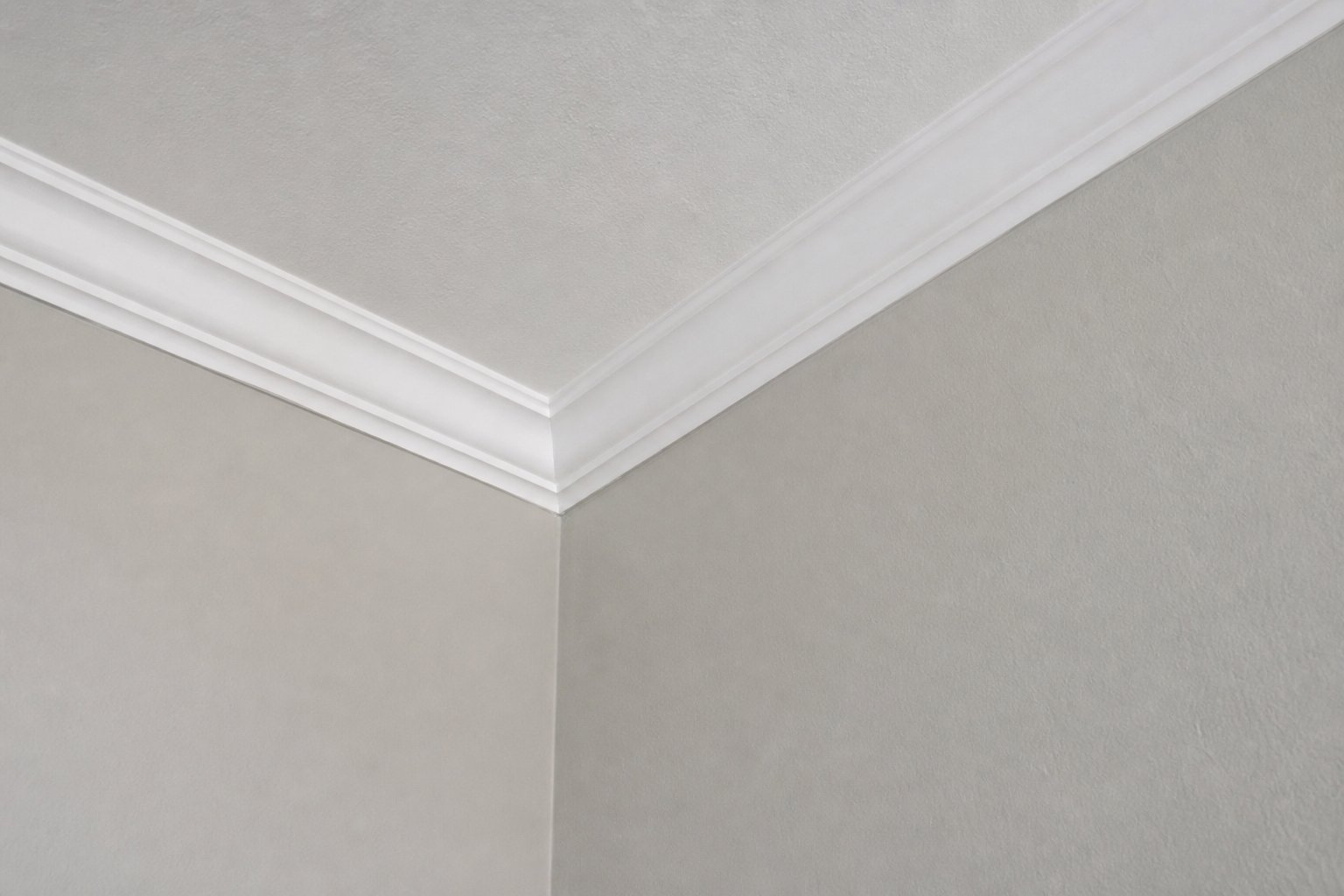 Smooth new drywall ceiling corner meeting crisp white crown molding