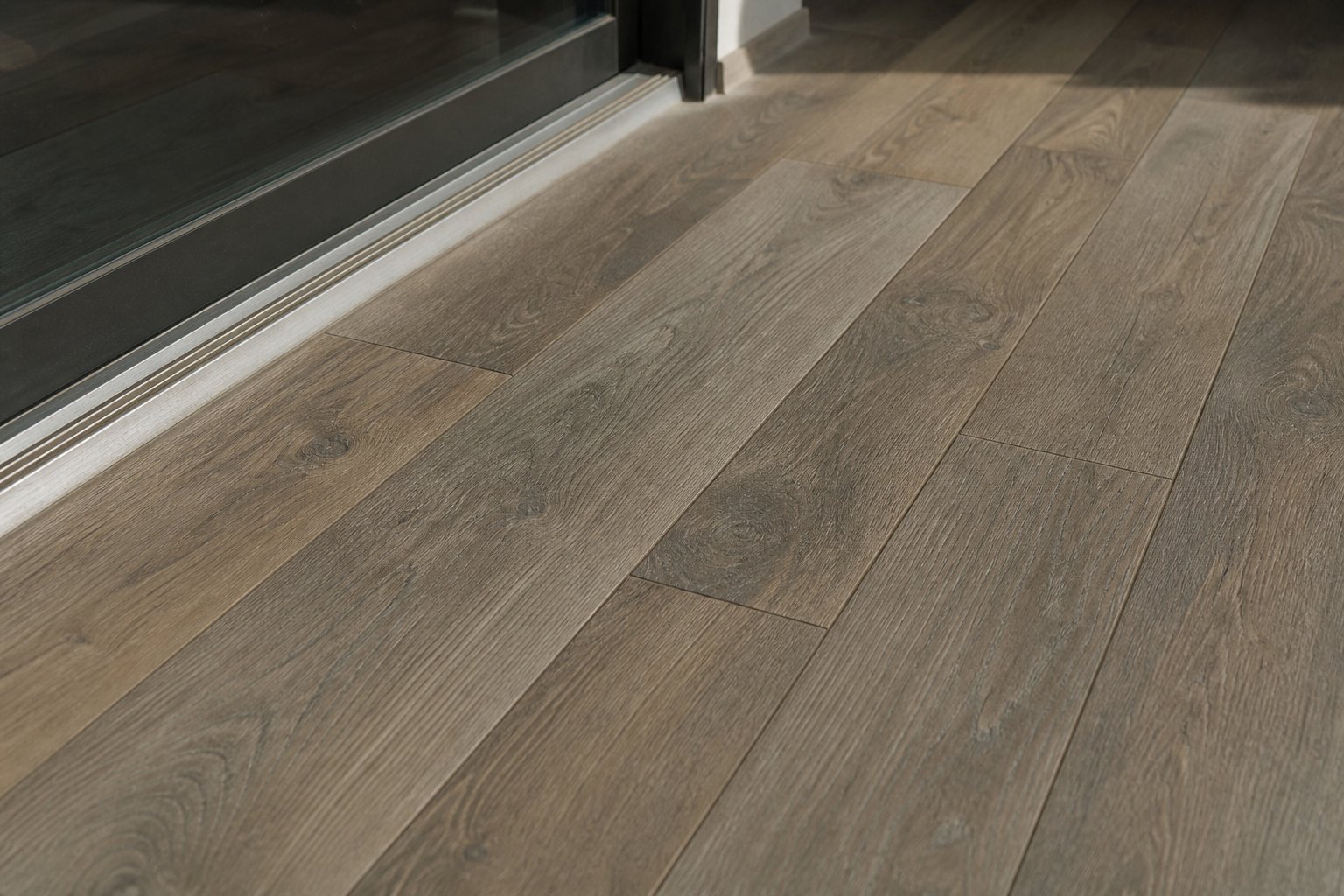 Close view of wood look porcelain tile planks with realistic grain and thin grout lines