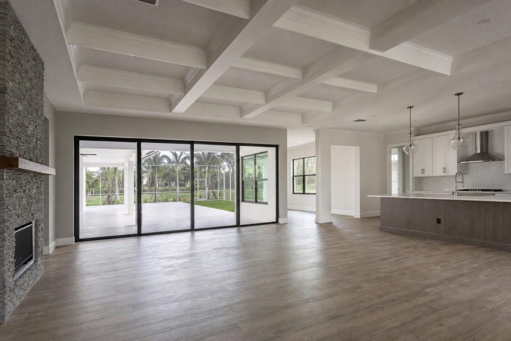 White coffered ceiling with evenly spaced beams in a Bonita Springs great room