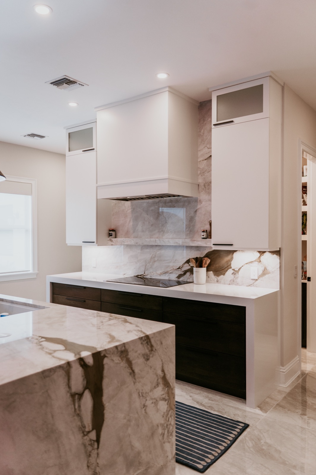 Marble waterfall island edge in a completed Alliance kitchen