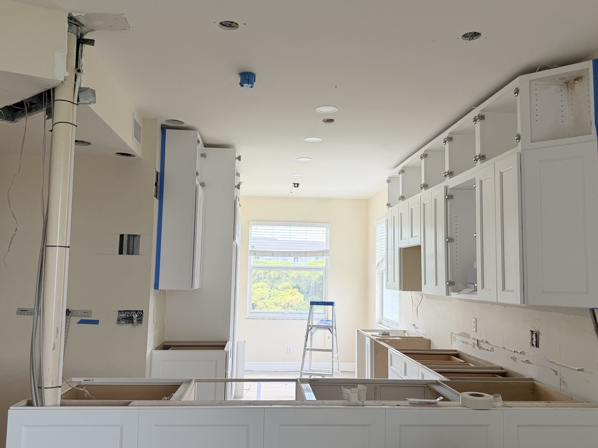 White shaker kitchen cabinets installed during a Fort Myers whole home remodel by Alliance Construction