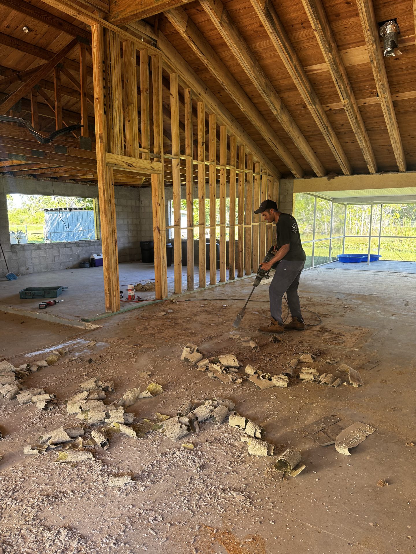Framing and floor preparation with an Alliance crew member on site