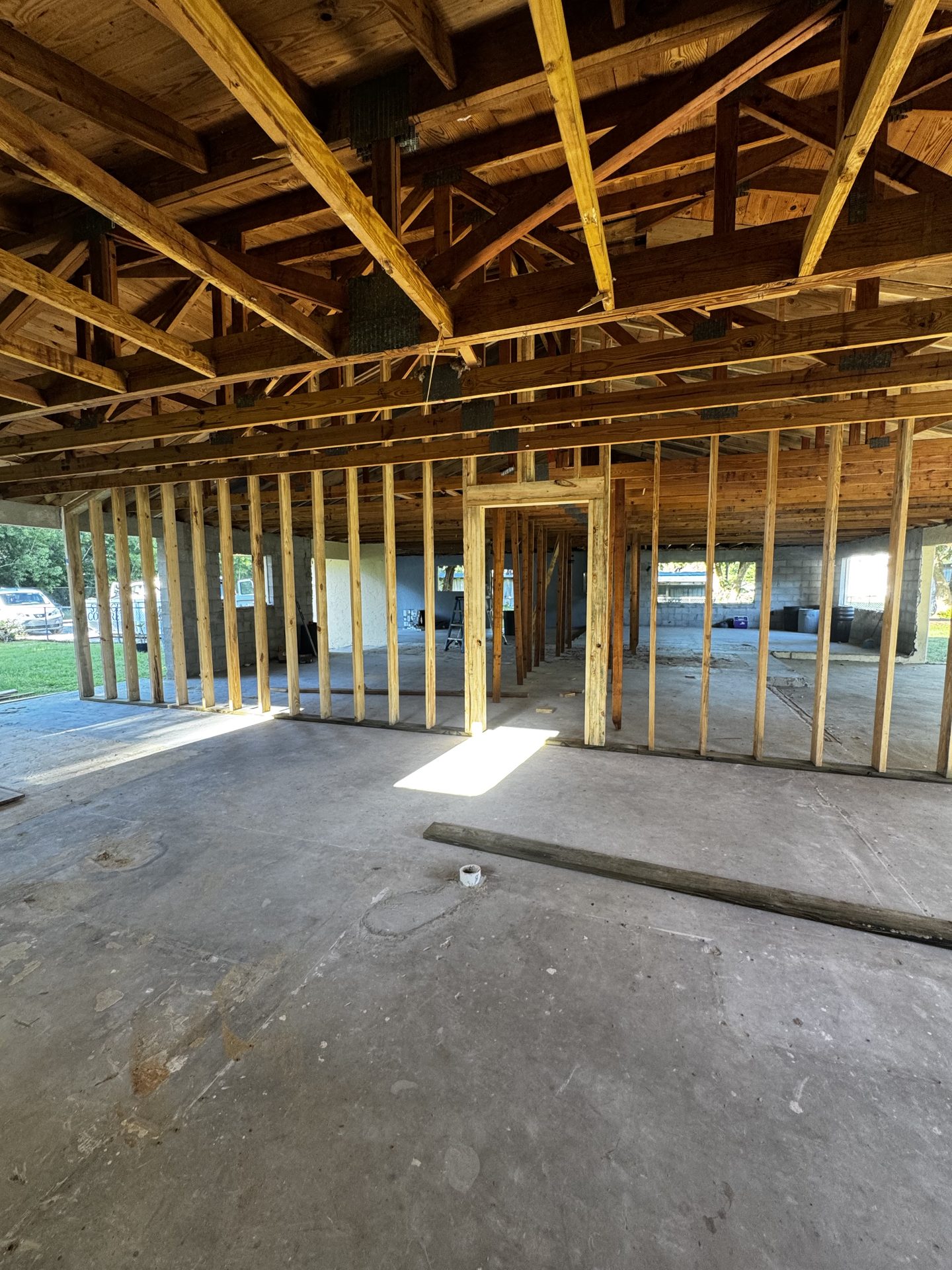 Home interior taken back to wood framing during a Fort Myers whole home renovation