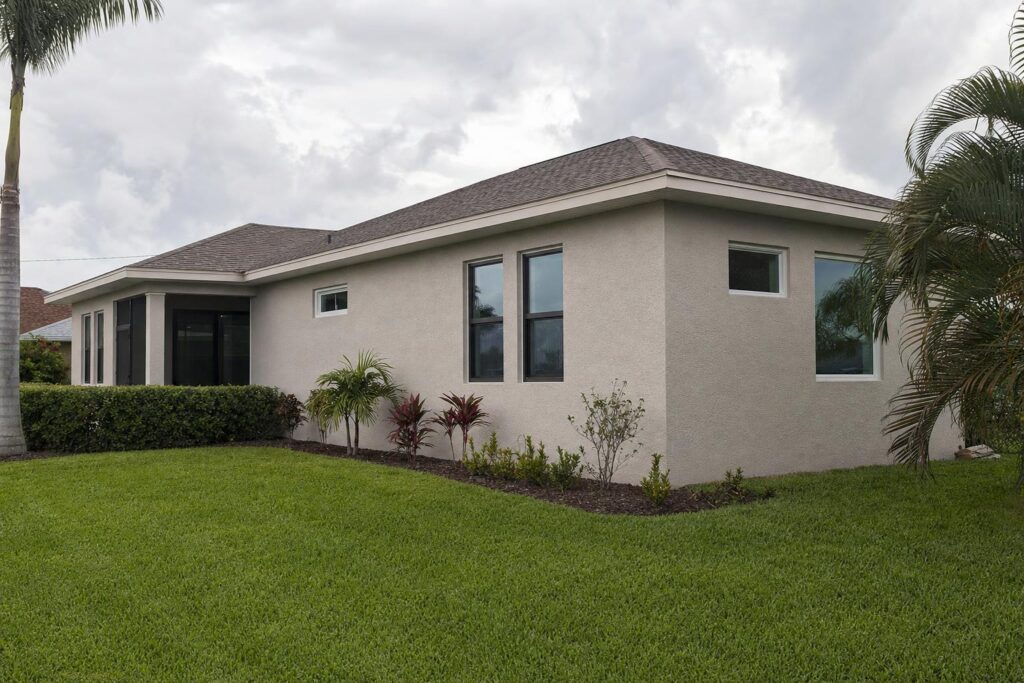 Single-story room addition matched to a North Fort Myers stucco home
