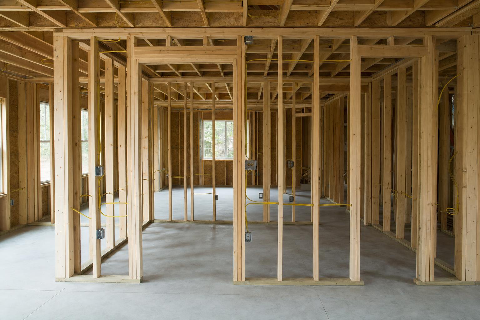 Room addition framing and utility rough-ins on a slab foundation