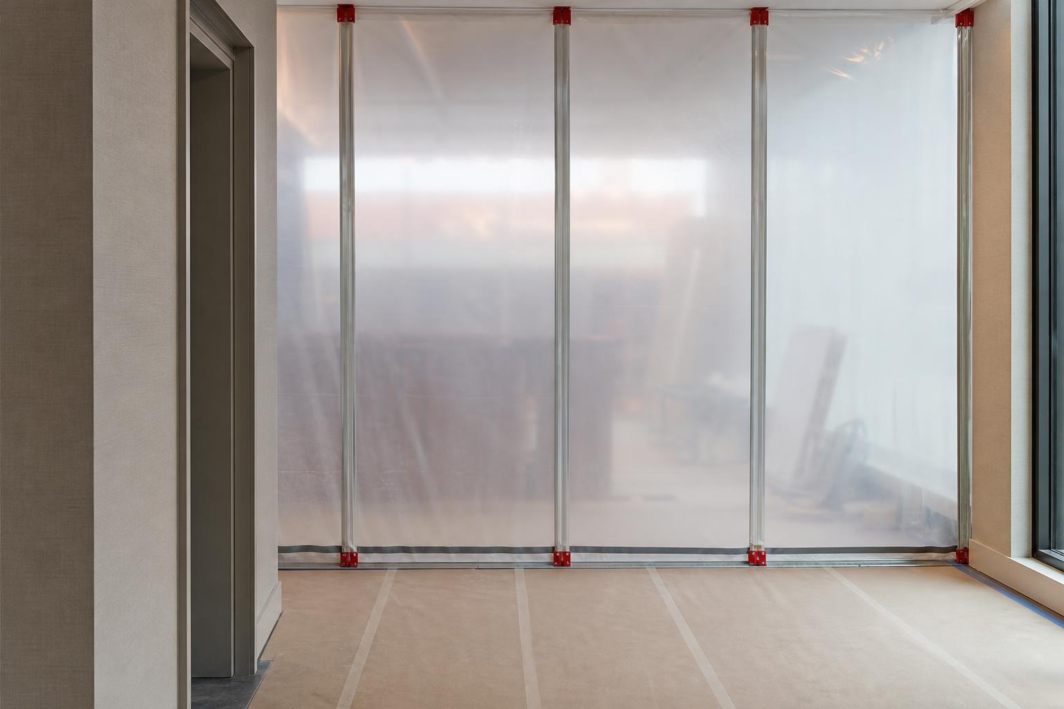Temporary dust-control wall during a Fort Myers office renovation