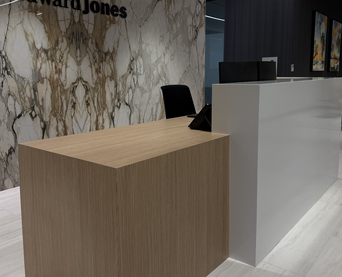 Custom reception desk cabinetry in a Fort Myers workspace